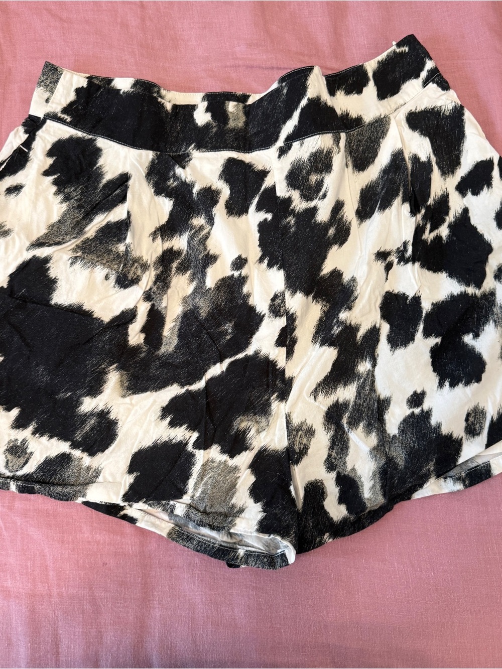 We Wore What black & white cow print flared shorts